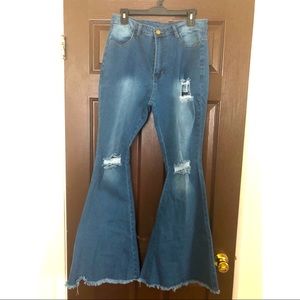 Distress bell bottom blue jeans